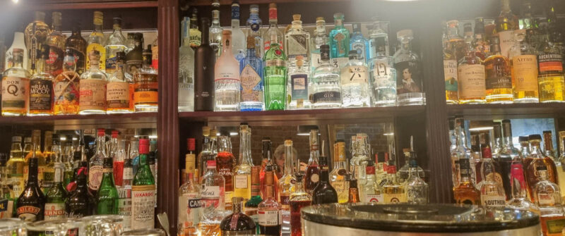 WC Cocktail bar packed with bottles and atmosphere